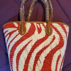 New never used red and white straw purse w/zipper